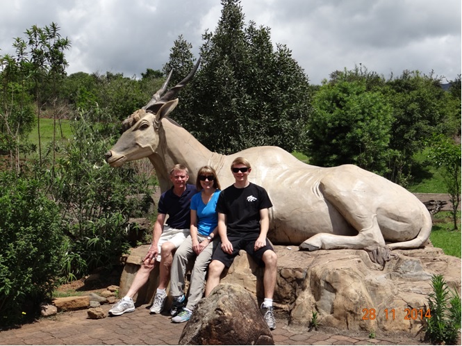 My clients and a statue of an Eland antilope at Didima during our Drakensberg Tour